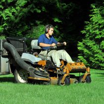 Photo of man on mower